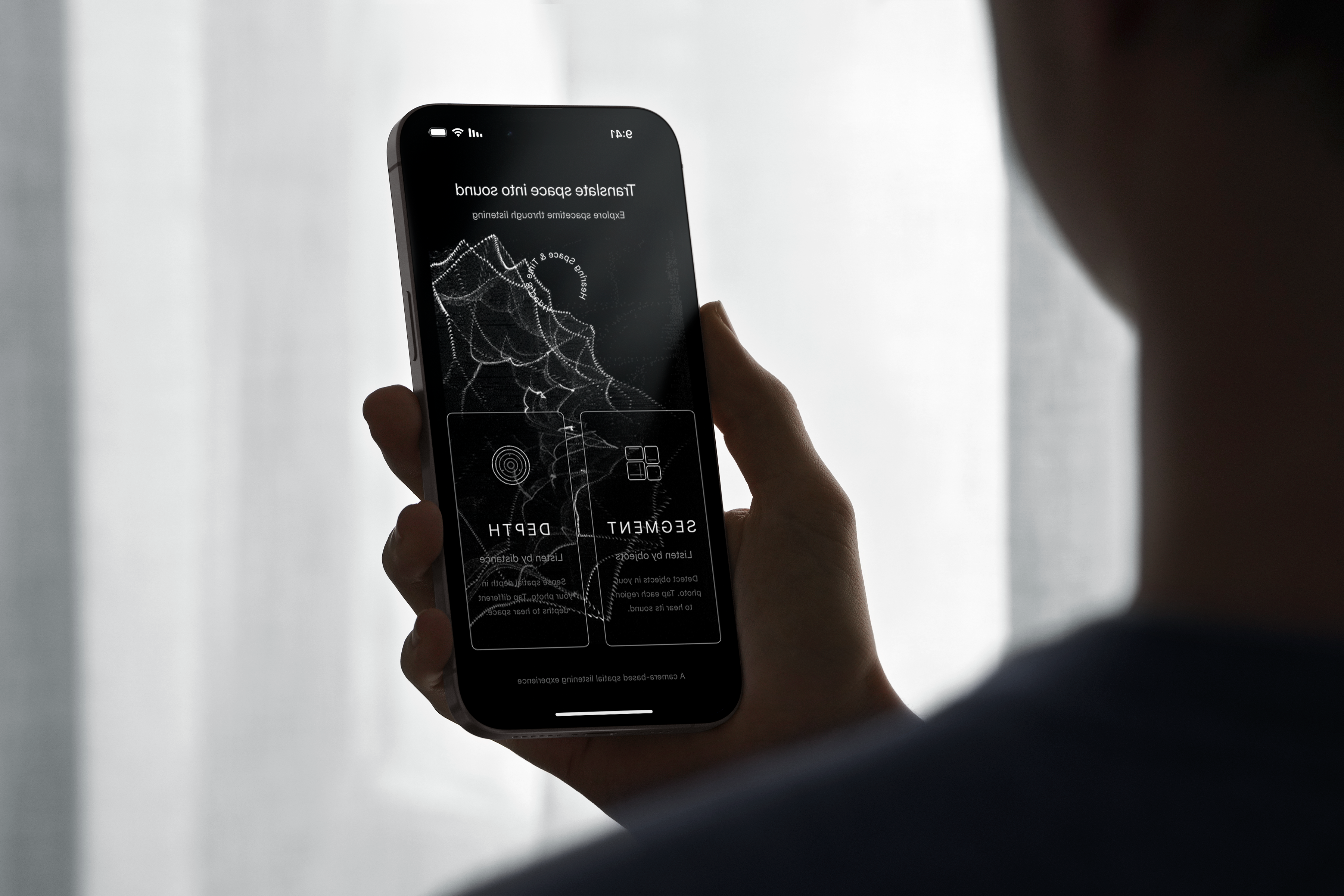 Hearing Space — hand holding phone